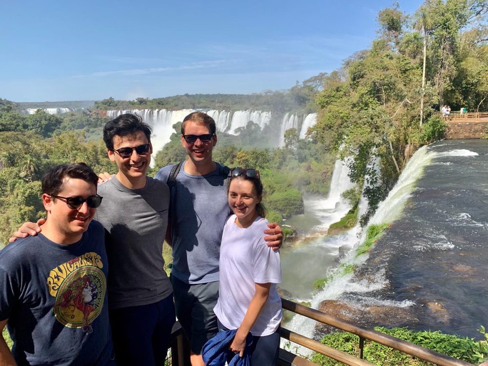 Four travelers in front of Iguazú Falls