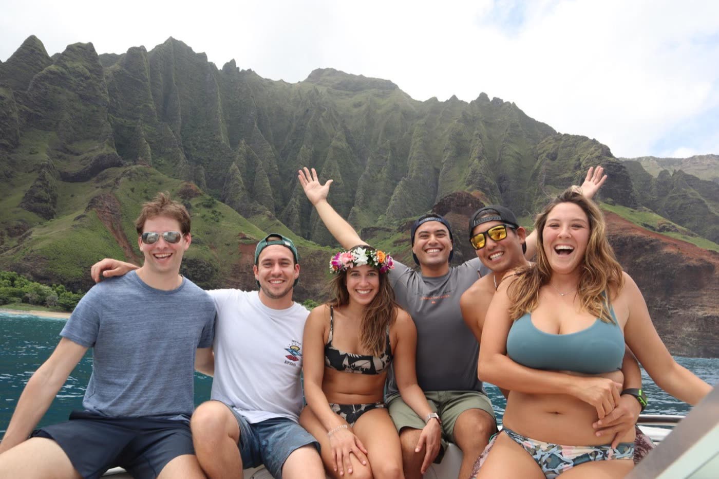A Pangea group on the water below the Nā Pali coast